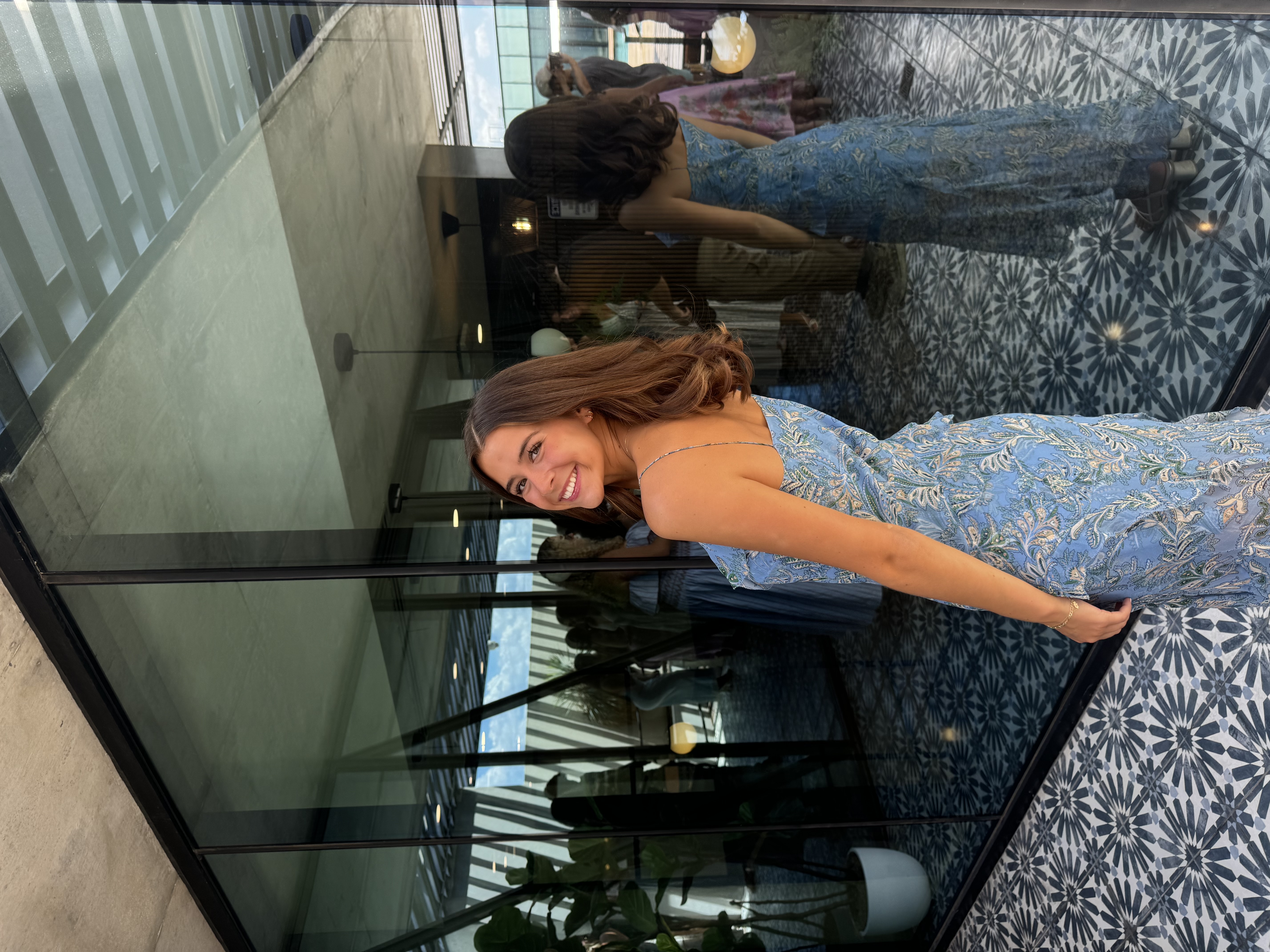 Gabbi Butler smiling in a blue dress